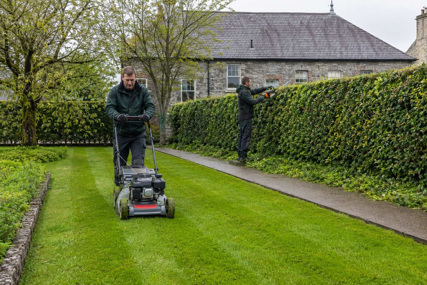 Grass cutting and hedge trimming grounds maintenance at a business park
